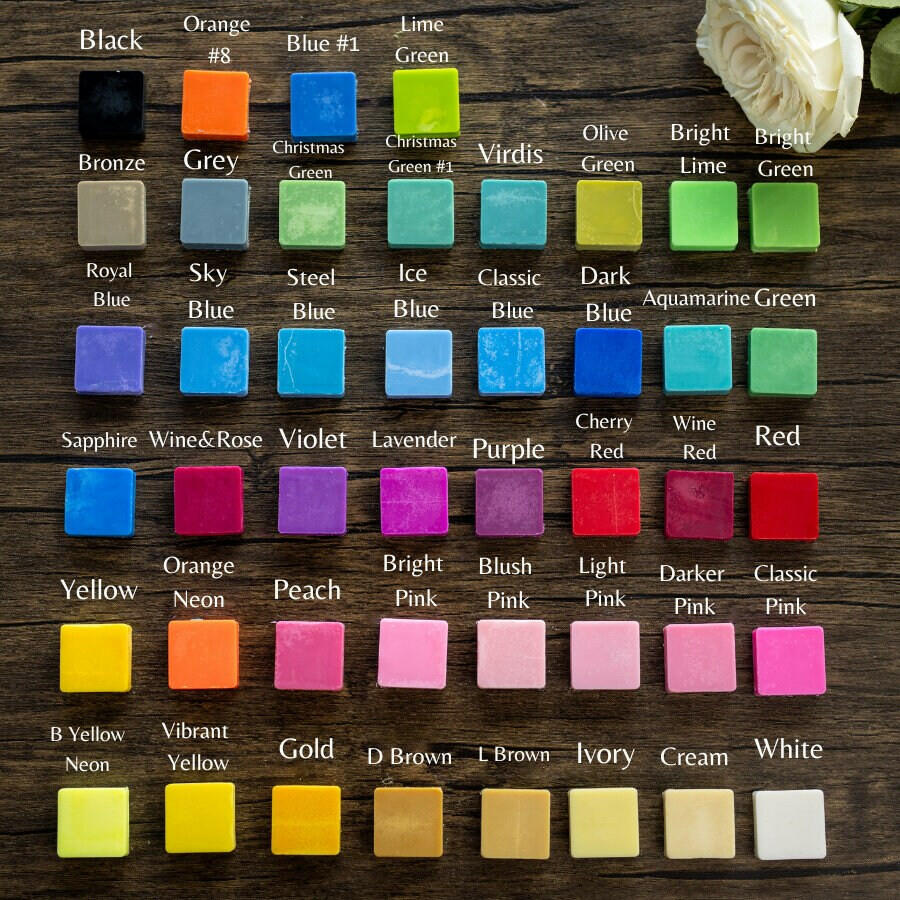 Candle wax color swatch chart showing many colored blocks, including white and red