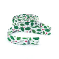 Double-fold 1/2in bias tape, white with green holly leaves and red berries, coiled roll
