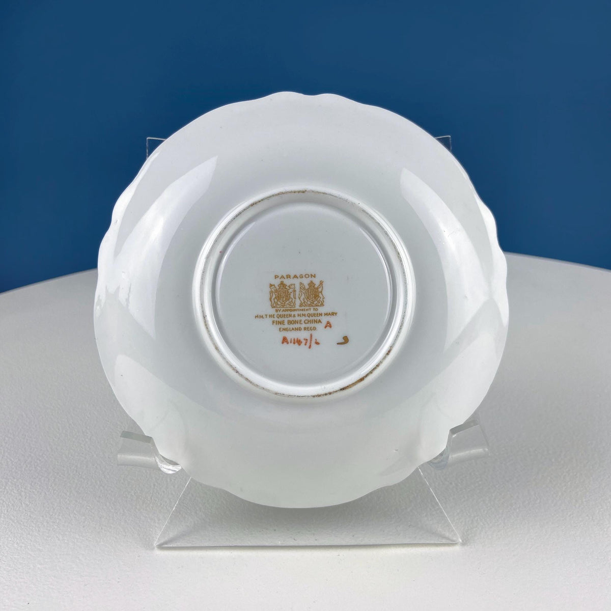 Ceramic tea cup saucer base with printed maker mark on underside