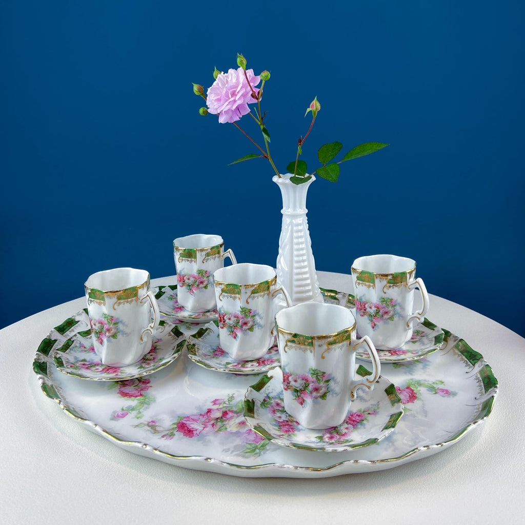 Antique-style hot chocolate serving set with oval tray and five rose-decorated cups