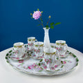 Antique-style hot chocolate serving set with oval tray and five rose-decorated cups