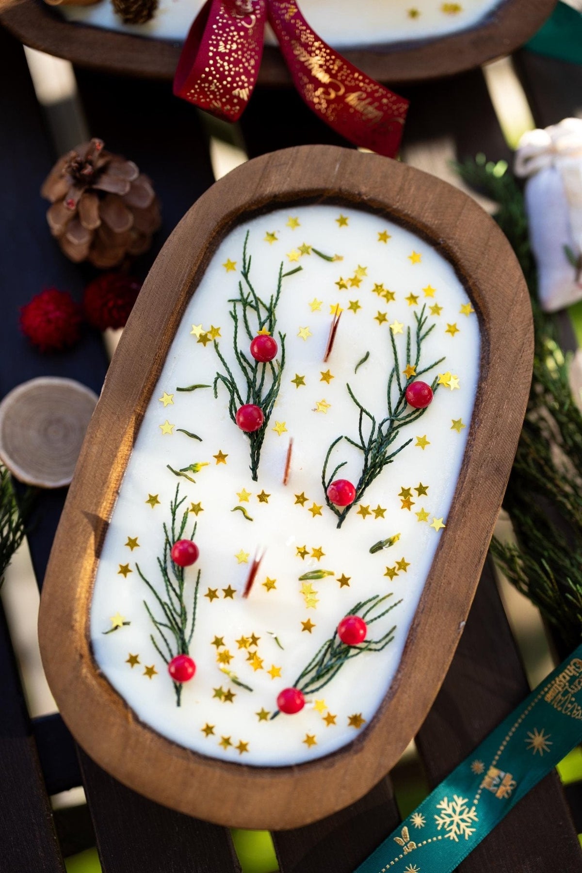Wood dough bowl candle with white wax and gold star sprigs illustration