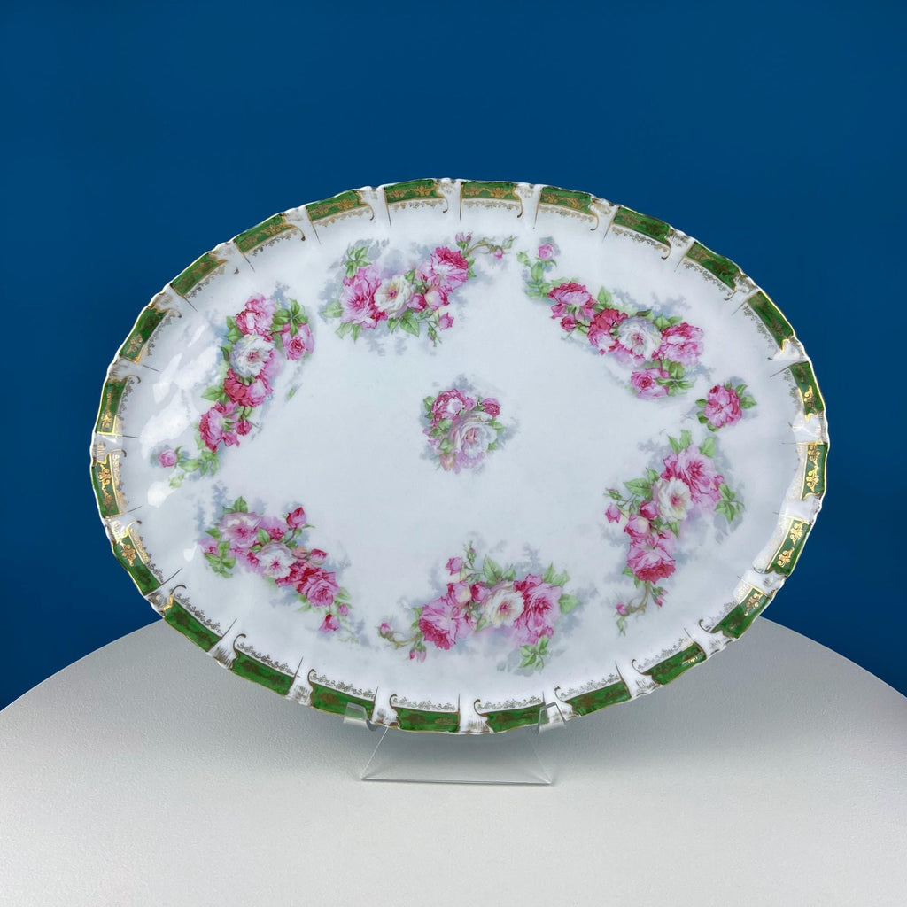 Oval serving tray with pink floral rose wreath pattern and green-and-gold trim