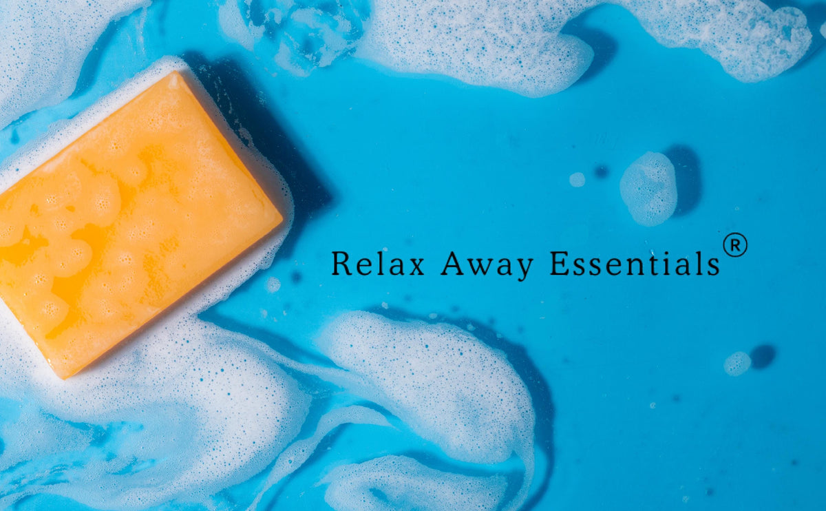 Orange soap bar on Relax Away Essentials splash graphic with brand name