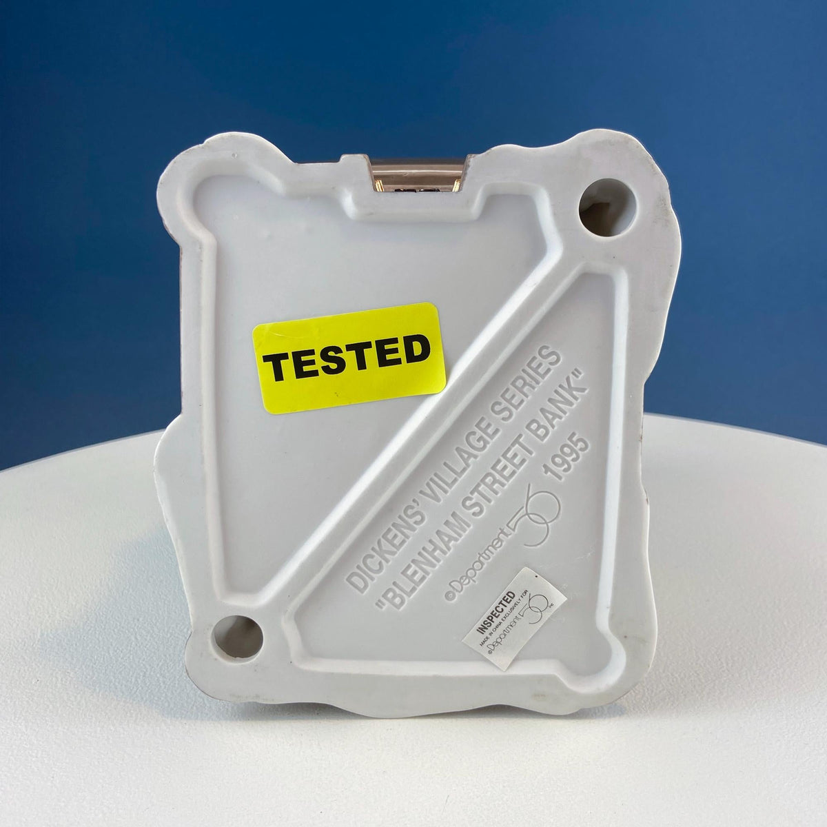 White back plate with “TESTED” label and Dickens Village series label