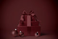 Burgundy gift wrapping paper with satin-style ribbon bow on a wrapped box