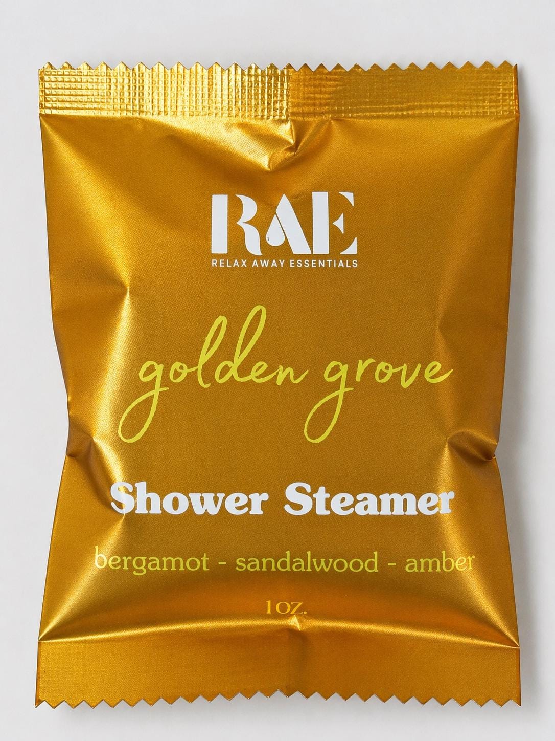 Golden Grove shower steamer pouch, gold foil packet with RAE logo and scent notes