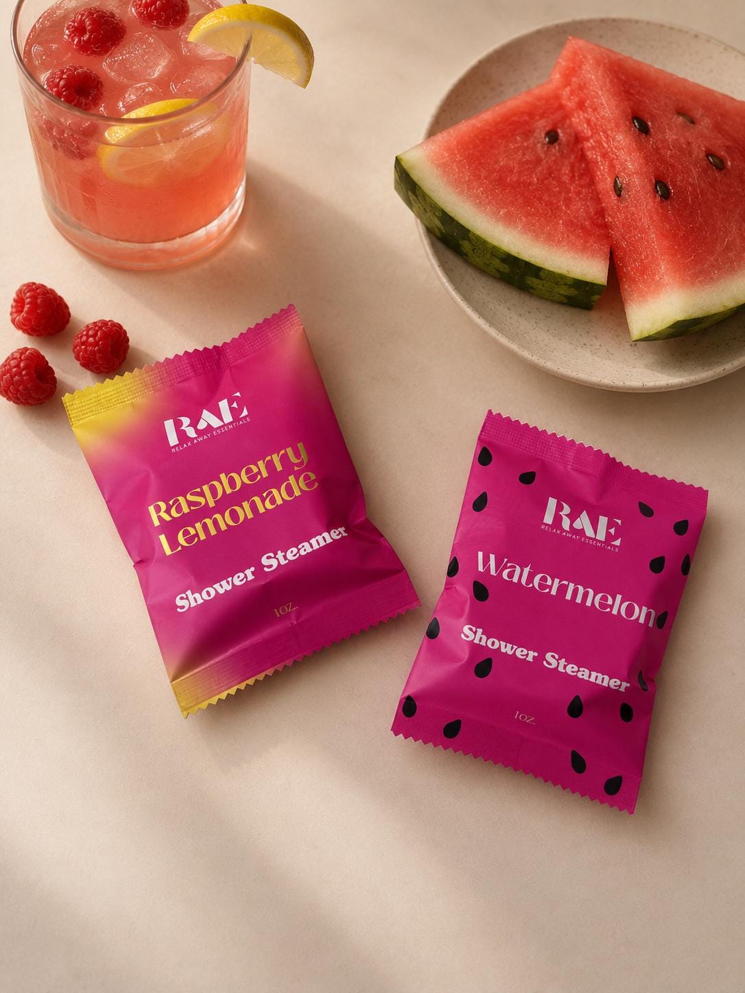 Raspberry Lemonade shower steamer packet in magenta with label text