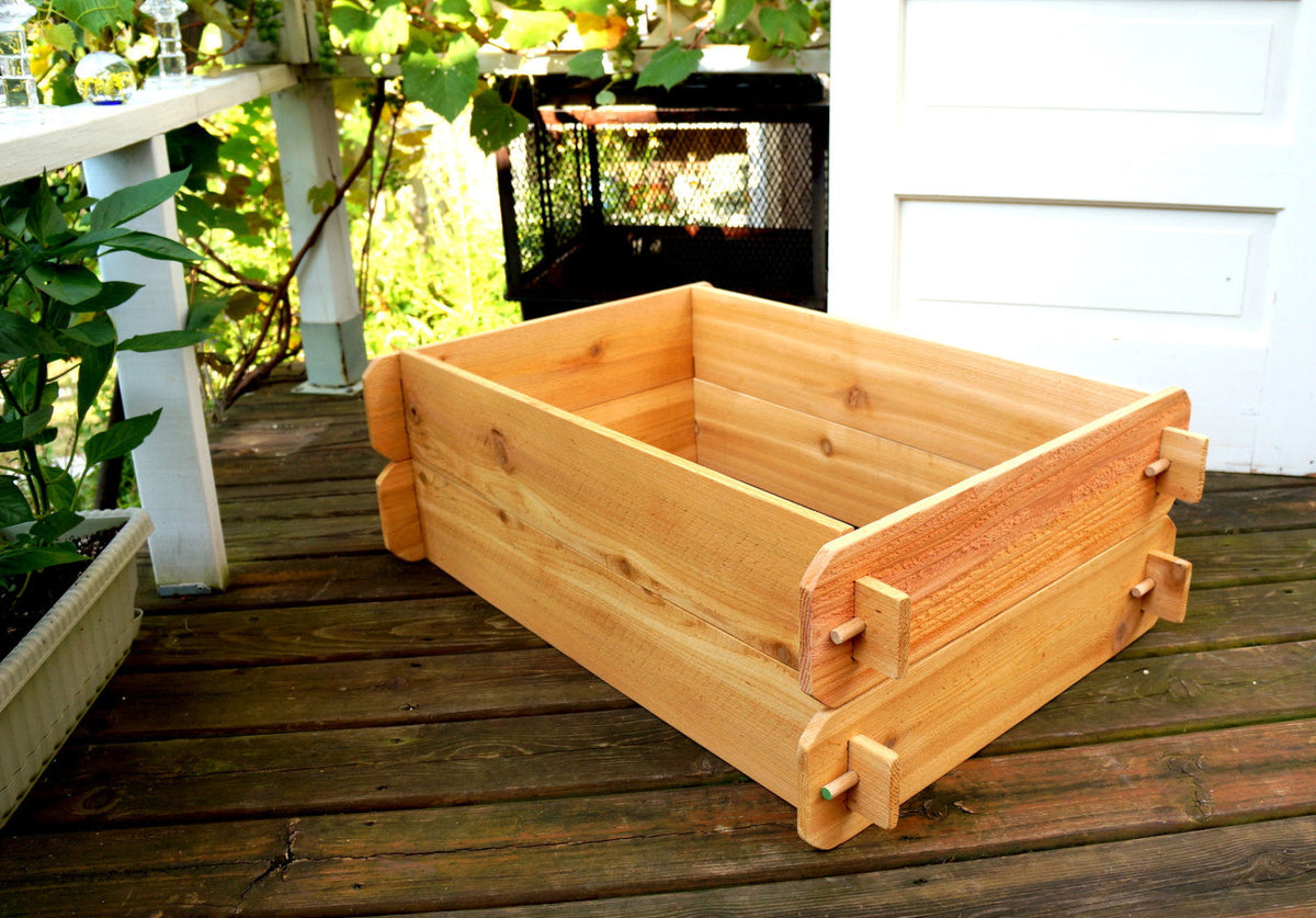Cedar raised garden bed kit with double-deep frame on outdoor deck