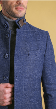 Deep blue overcoat close-up showing double-breasted buttons and chest flap pocket.