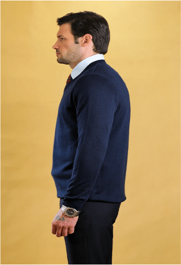 Dark V-neck knit sweater on model, side view with long sleeves