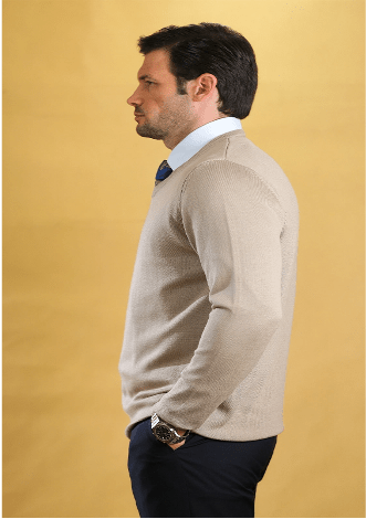 Tan v-neck sweater side view with ribbed knit texture