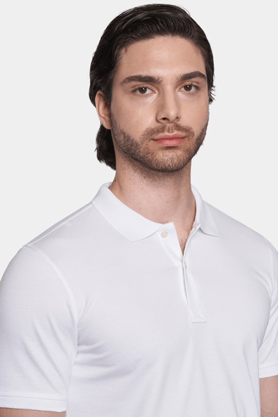 Close-up of white mercerized cotton polo shirt collar and 1-button placket