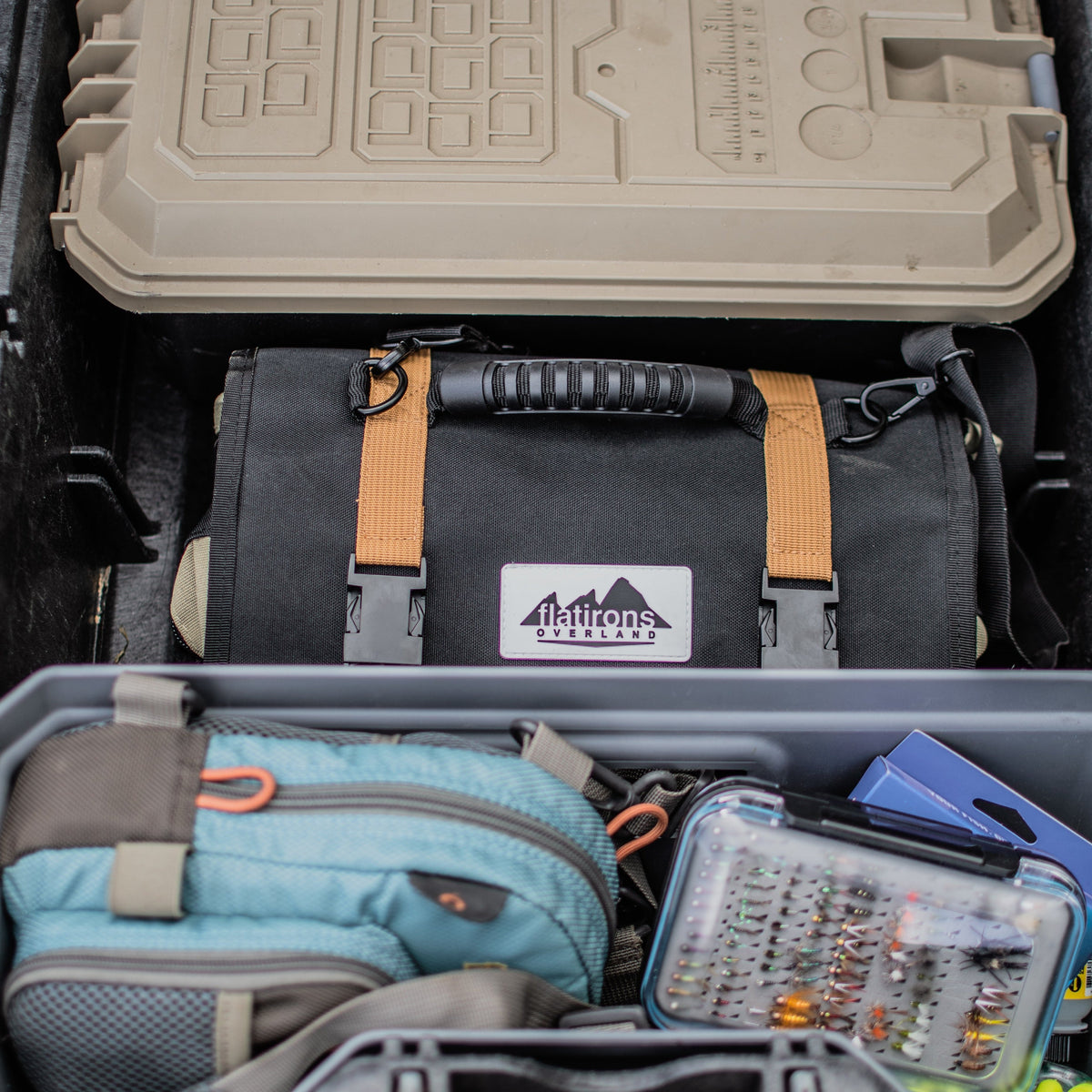 RiPouch Gear Roll partially open inside a toolbox-style container with tools visible