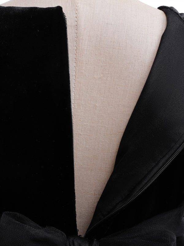 Back view of black witch dress with zipper and fitted shoulder panel