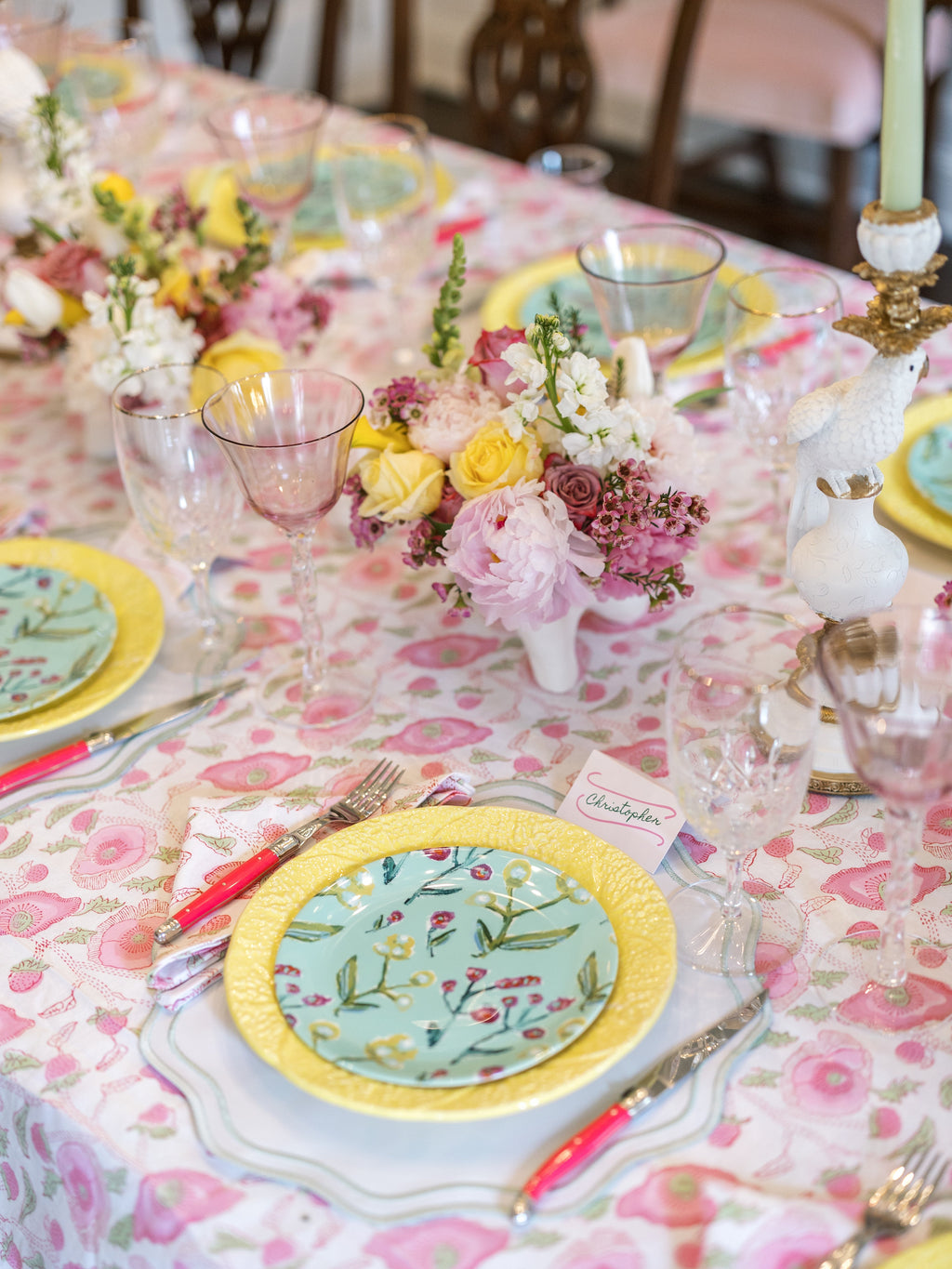 Botanical china plate with yellow and white border on floral tablescape