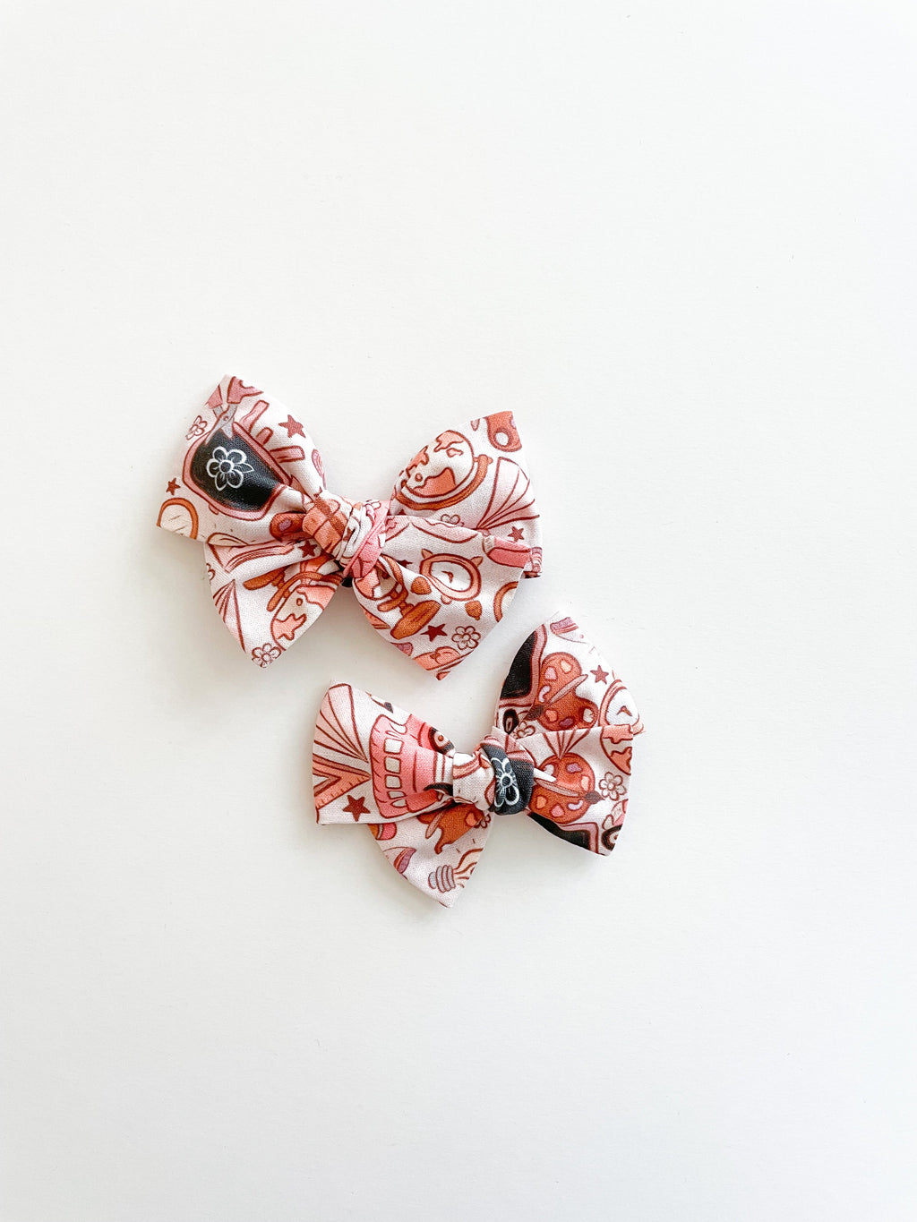Pinwheel hair bow set of three bows with pink and brown cartoon print