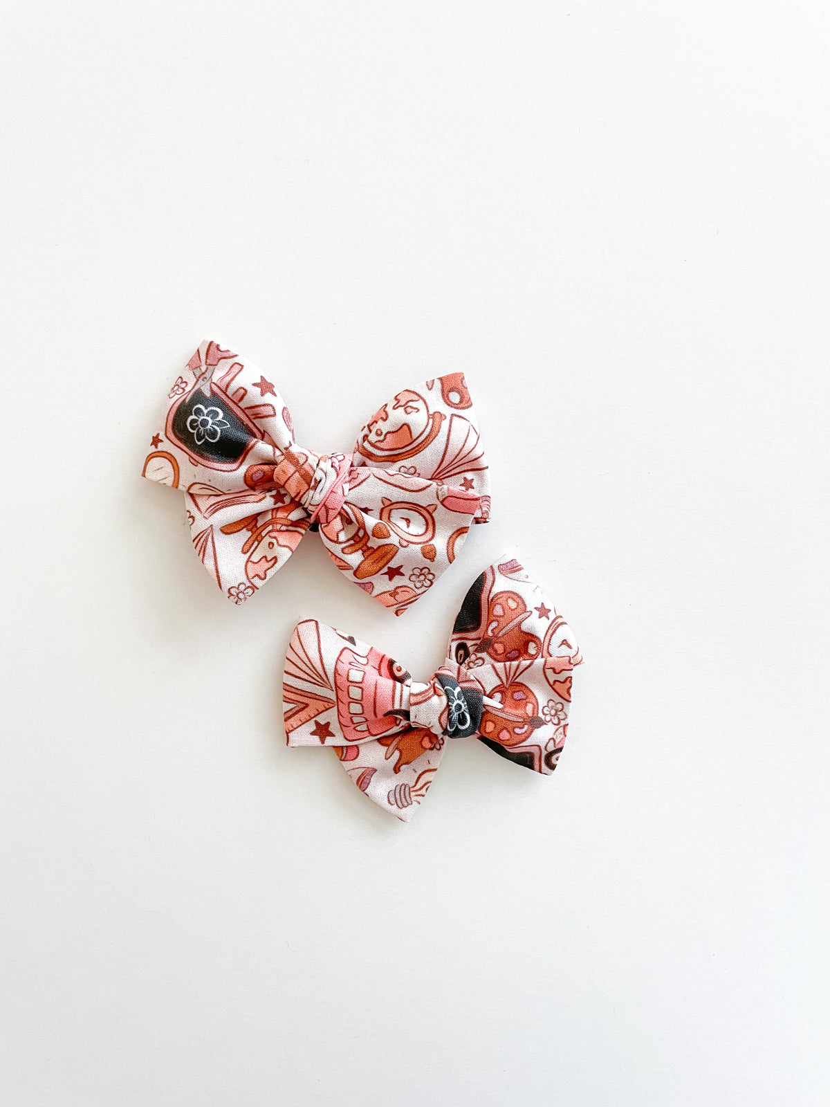 Pinwheel hair bow set of three bows with pink and brown cartoon print