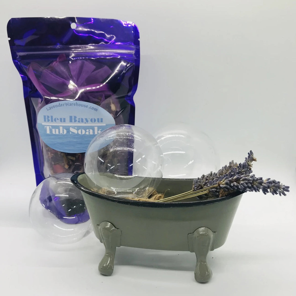 Tub soap set with purple pouch, lavender sprig, and small green footed soap dish