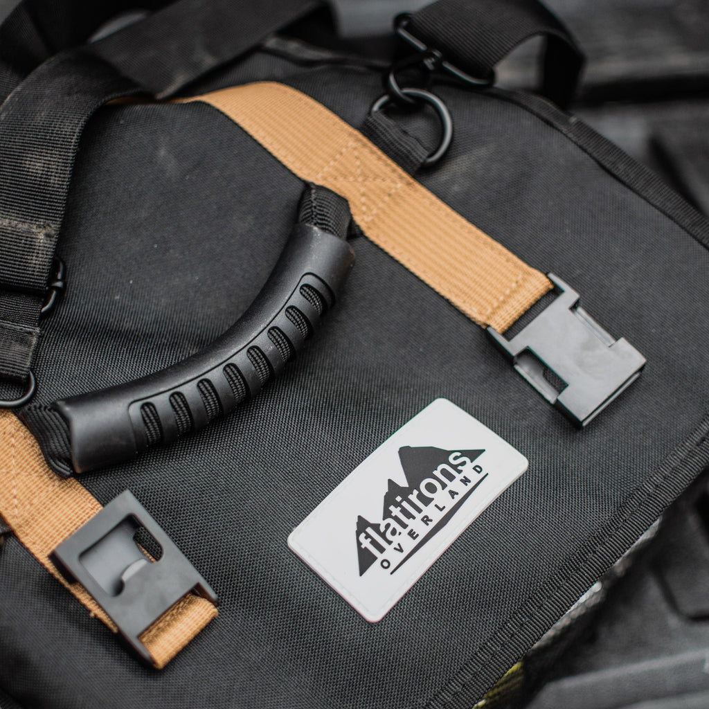 RiPouch Gear Roll close-up with tan straps, metal clips, and logo patch