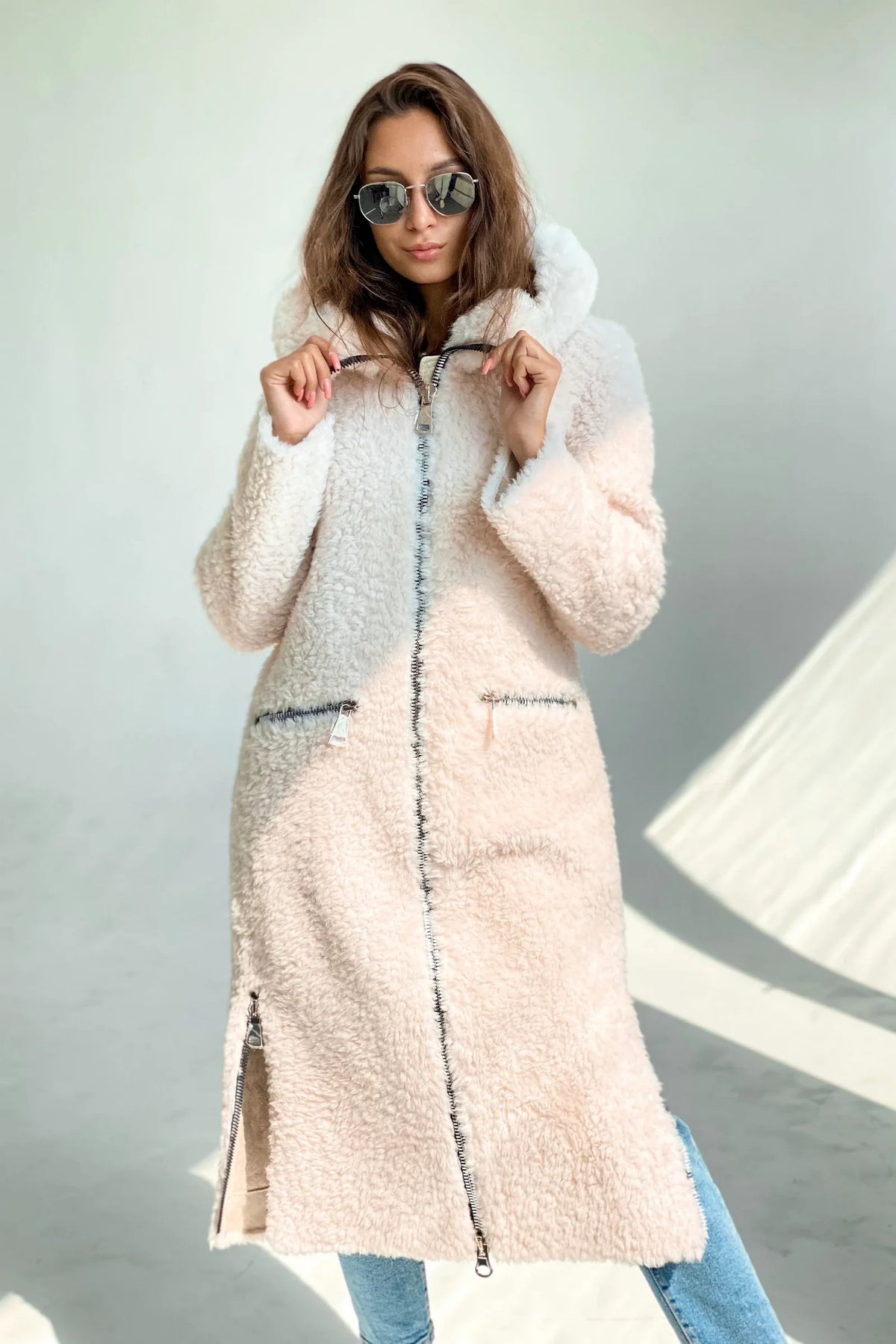 Light blush hooded fur coat with front zipper and two front flap pockets
