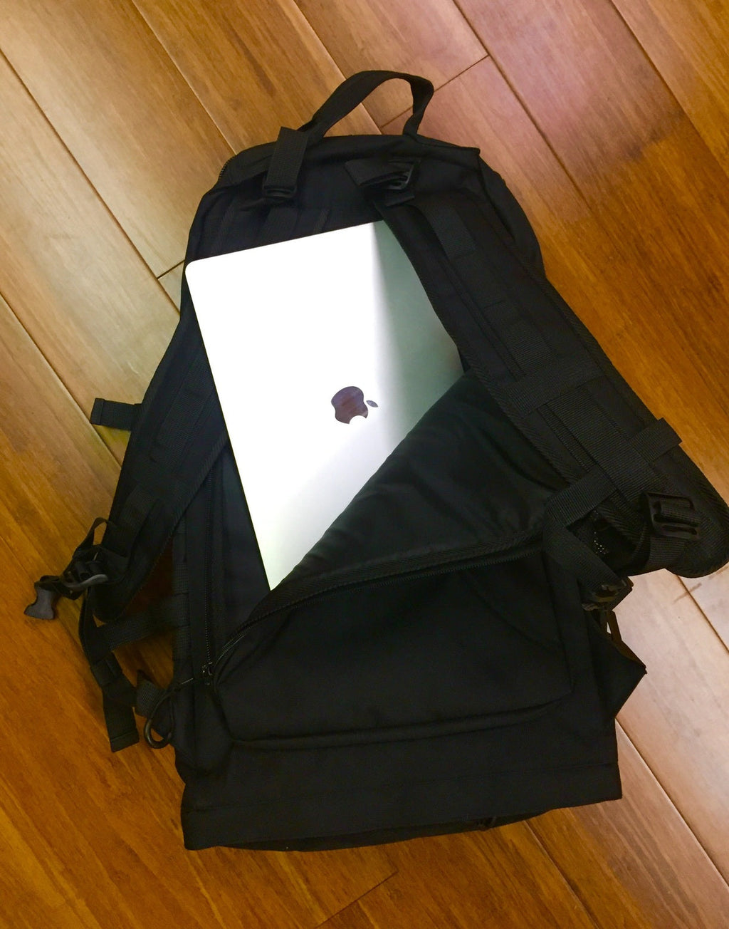 BKX black military backpack with padded straps and multiple front accessory compartments