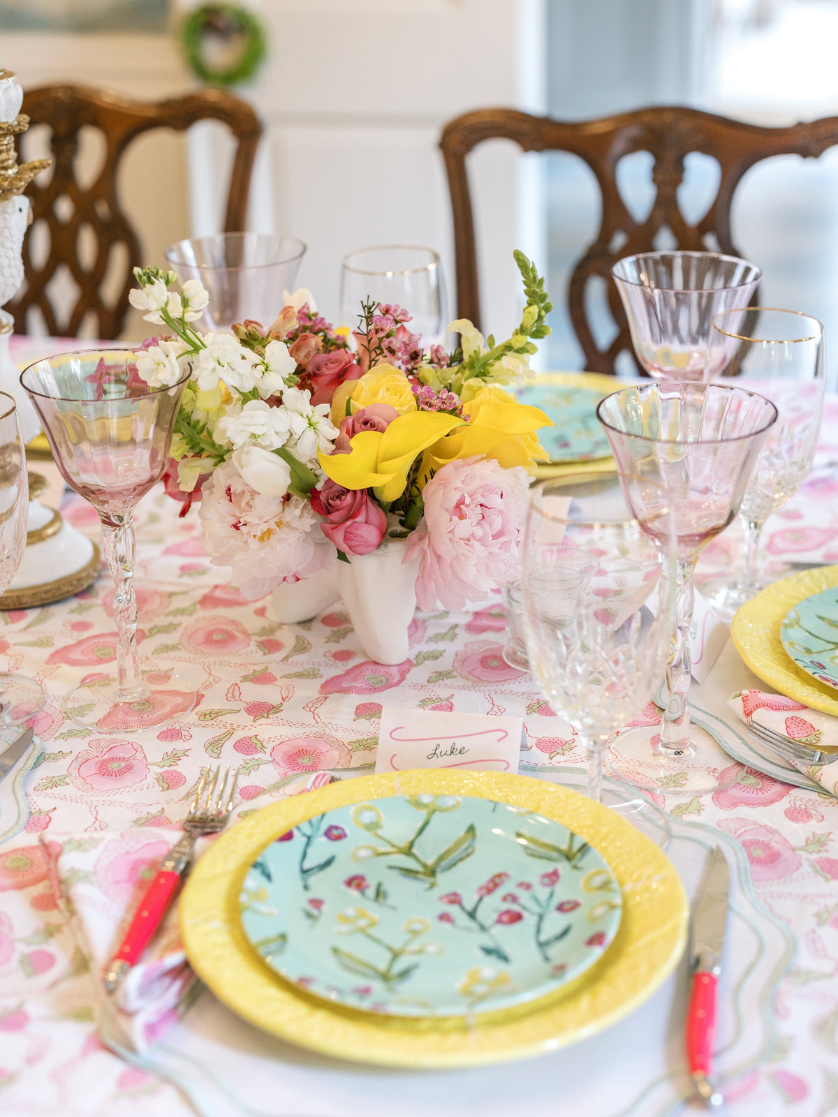 Botanical china plate with yellow and white rim on decorated dining table