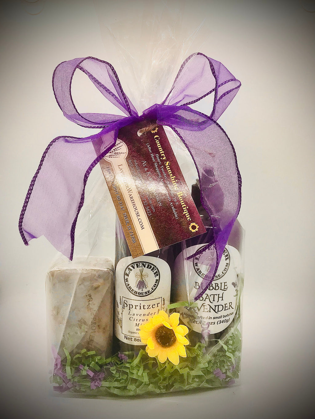 Lavender gift set in clear box with purple ribbon, soap, spritzer, and bubble bath