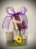 Lavender gift set in clear box with purple ribbon, soap, spritzer, and bubble bath