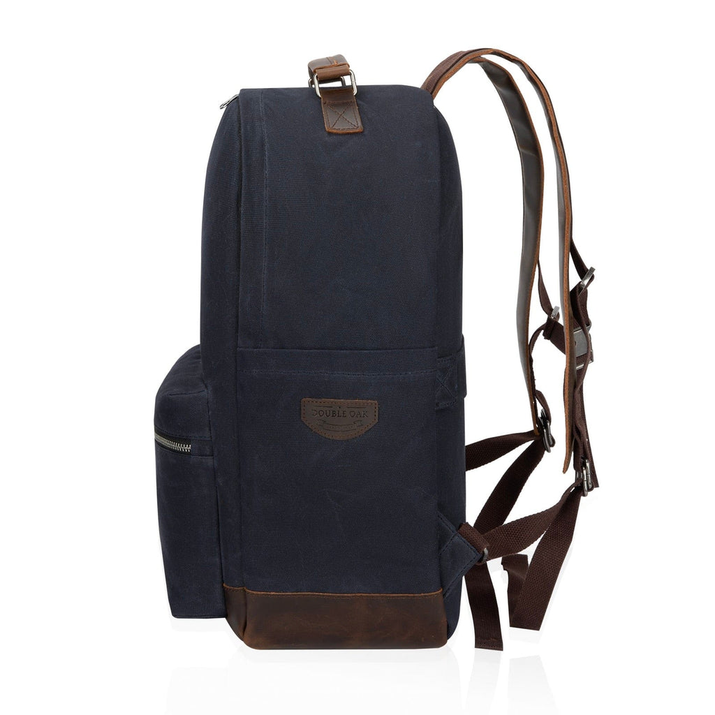 Navy canvas backpack with top handle, front flap pocket, and crossbody strap