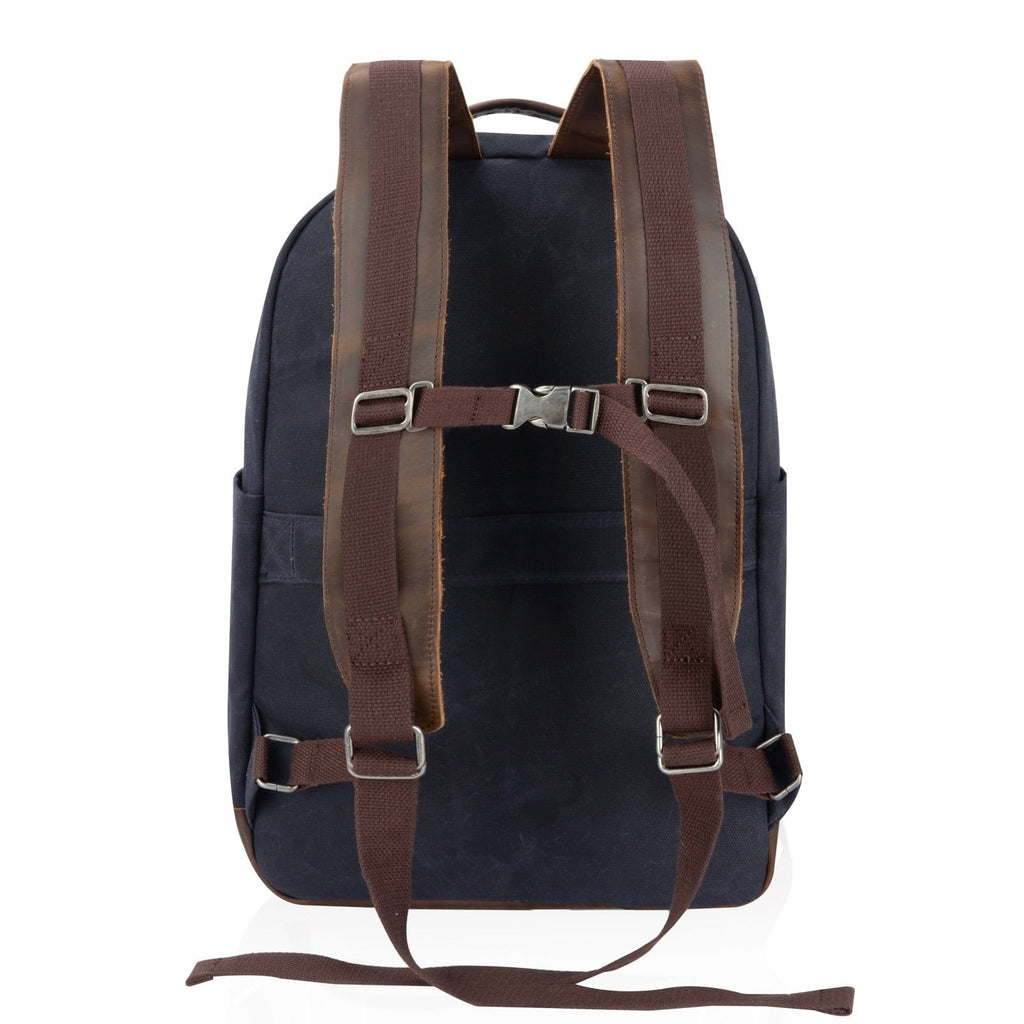 Navy canvas backpack with brown adjustable straps and front harness panel