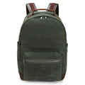 Dark green canvas backpack with brown leather straps and front zipper pocket