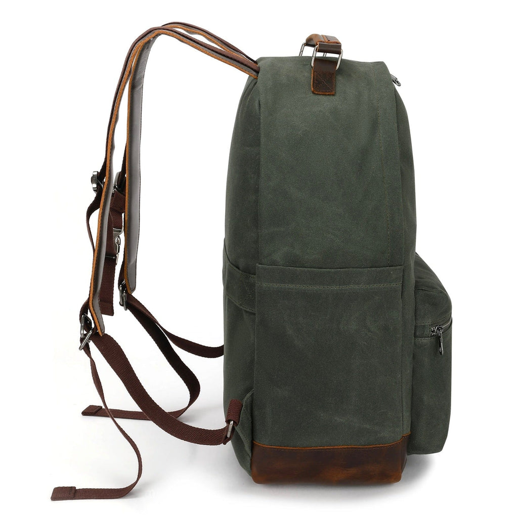 Dark green backpack with adjustable webbing straps, top handle, and side pocket