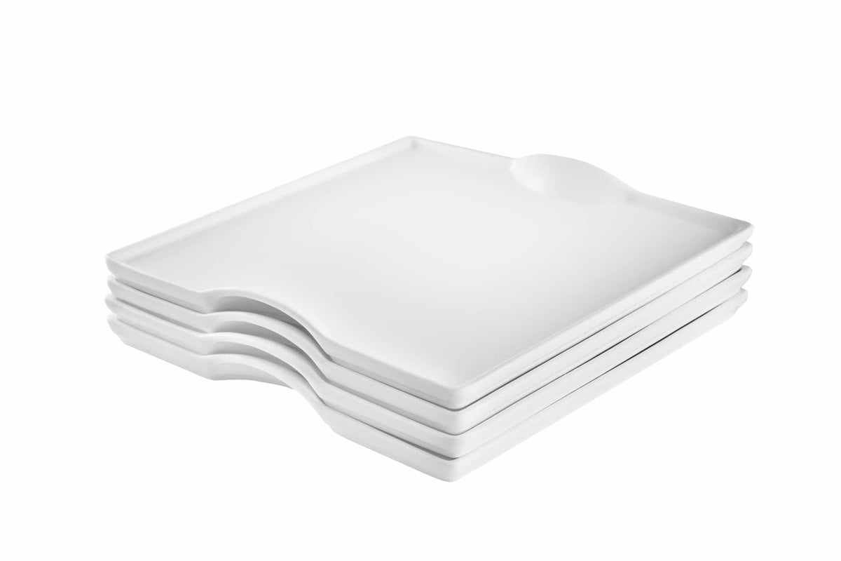 Stack of white square porcelain plates with beveled edges