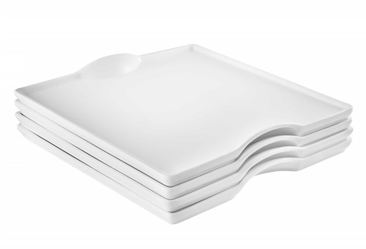 Stacked white square porcelain plates with rounded corners