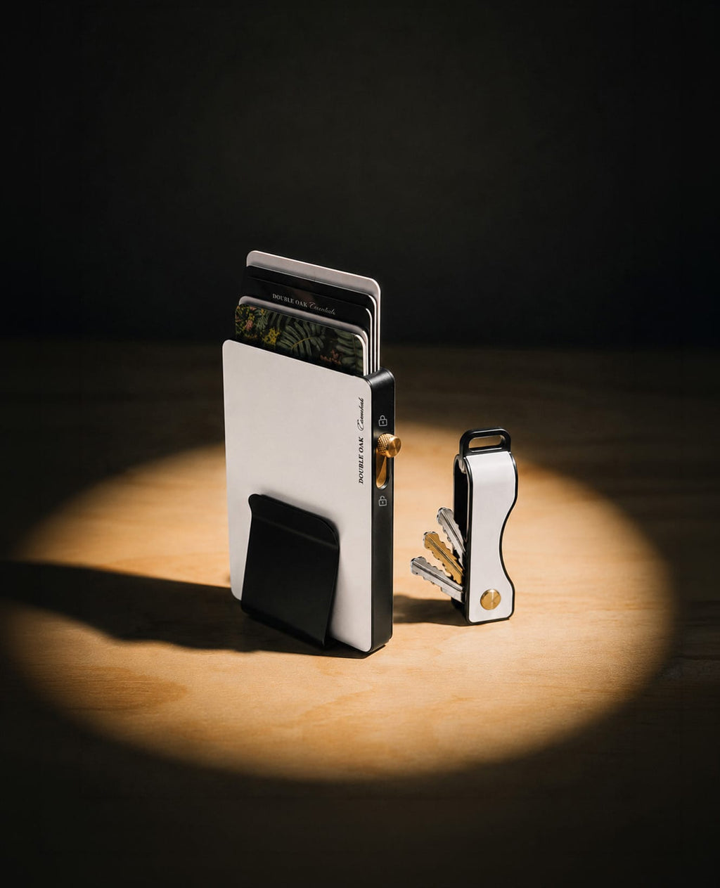 Pop-up cardholder with black front and gold-toned hardware, plus attached key ring