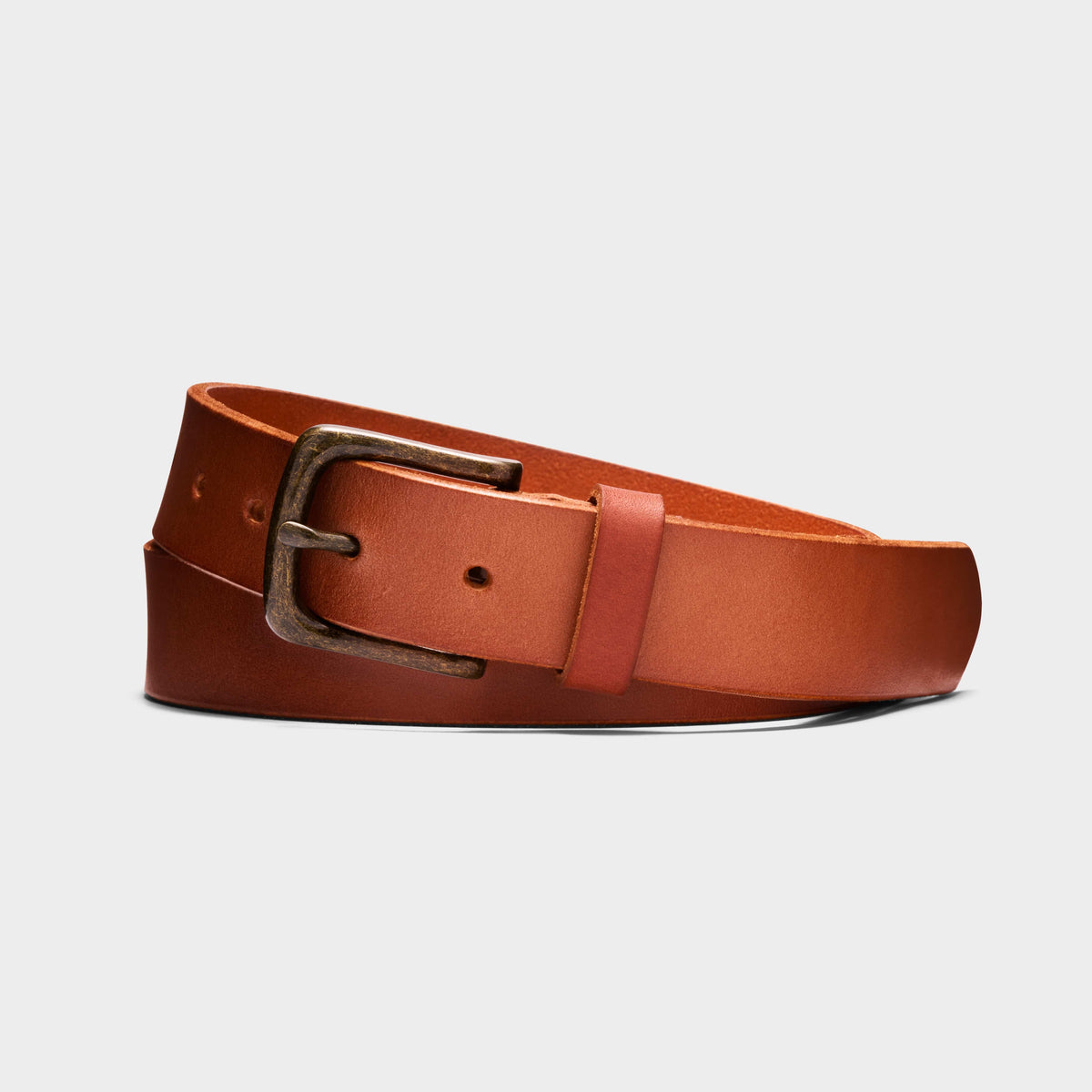 Brown leather stretch belt with antique silver-tone buckle and single keeper strap