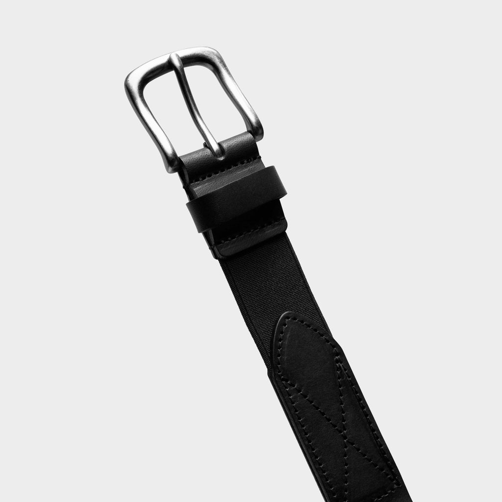 Black leather stretch belt with silver buckle and layered keeper strap detail