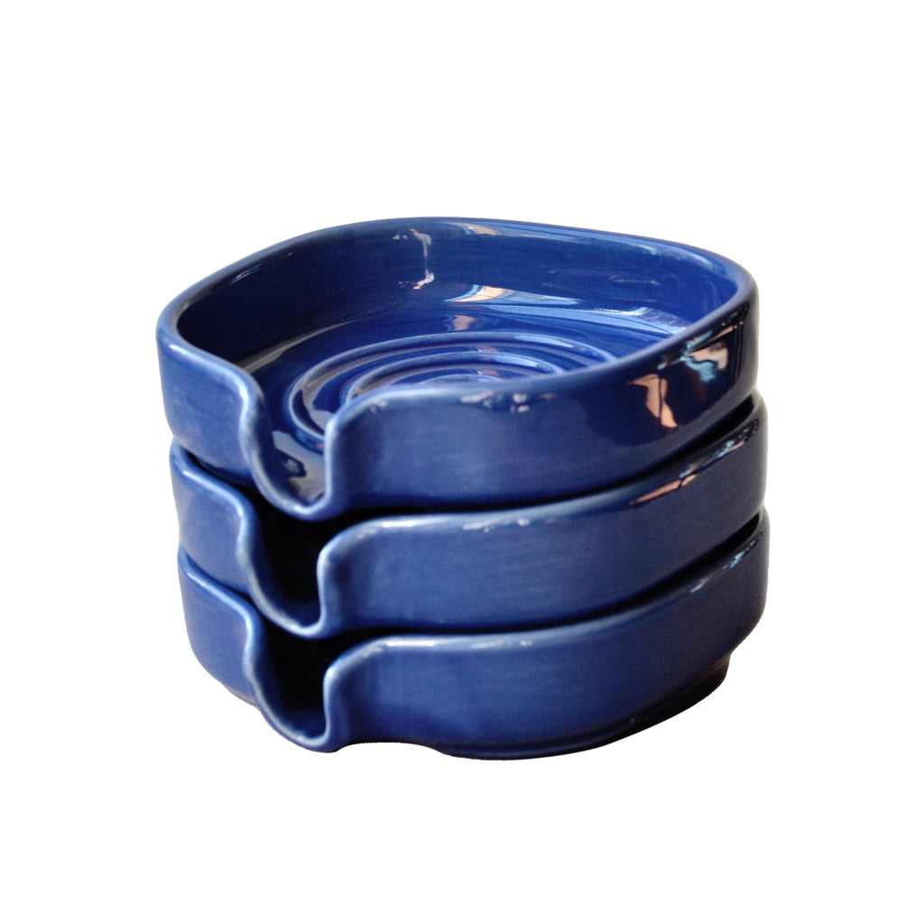 Cobalt blue porcelain soapdish showing the self-draining swirl basin