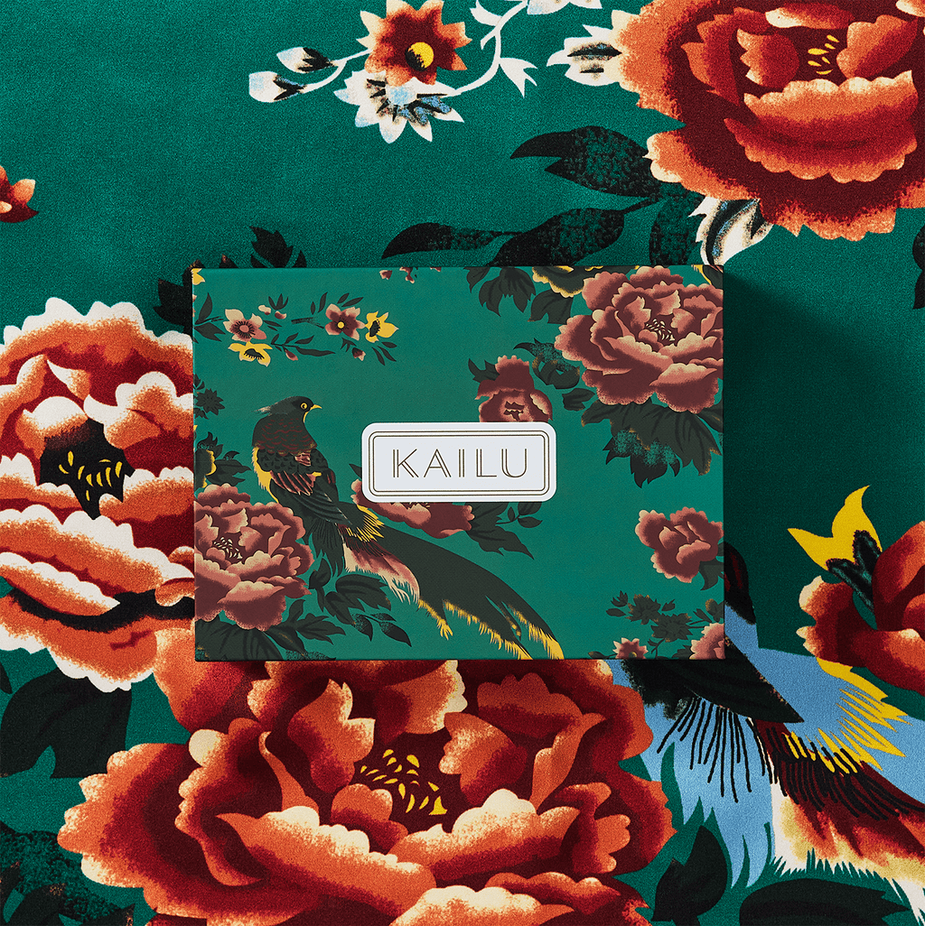 Teal silk scarf close-up of floral and bird design with KAILU label