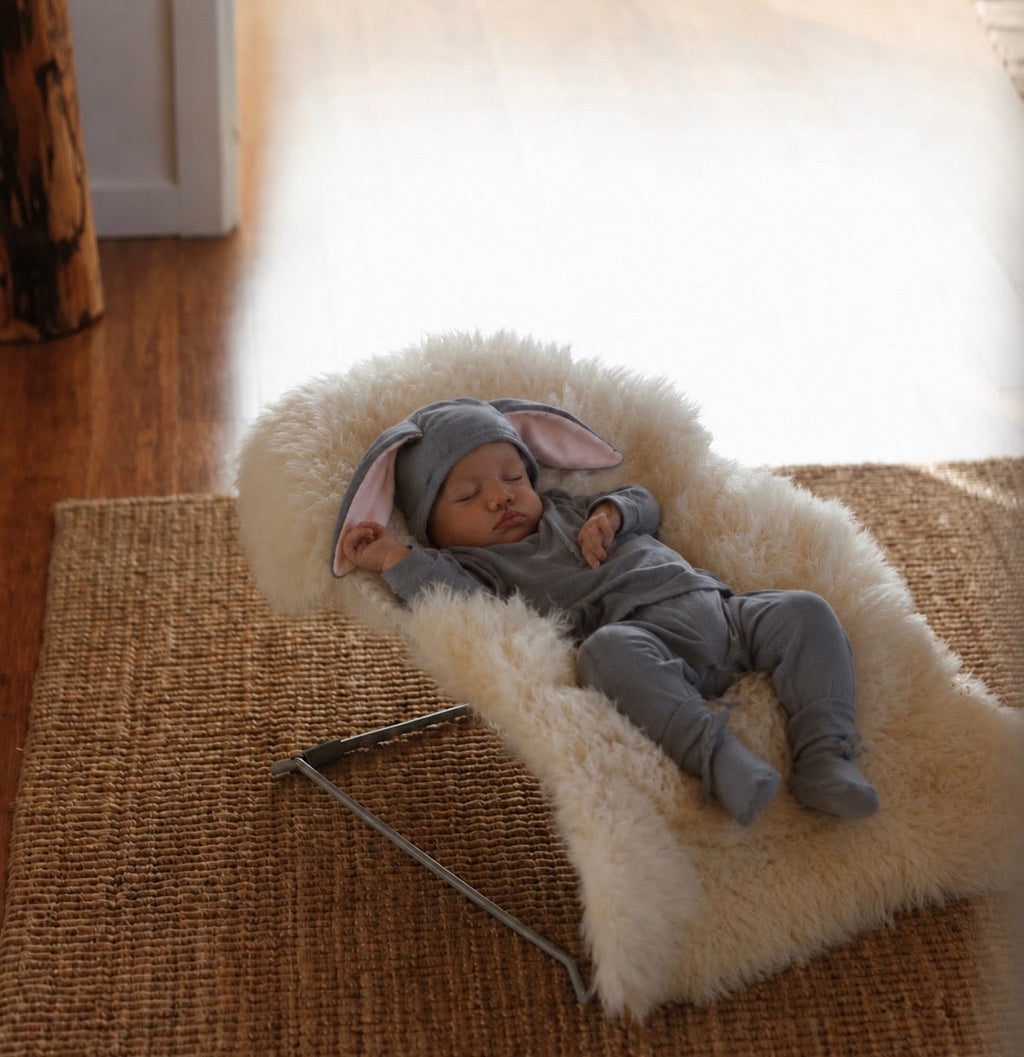 Grey bunny costume on infant: gray hooded suit with pink-lined bunny ears