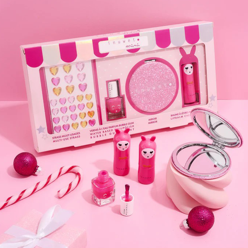 Pink kids makeup gift set box with glitter compact, lip balm tubes, mirrors, and charms