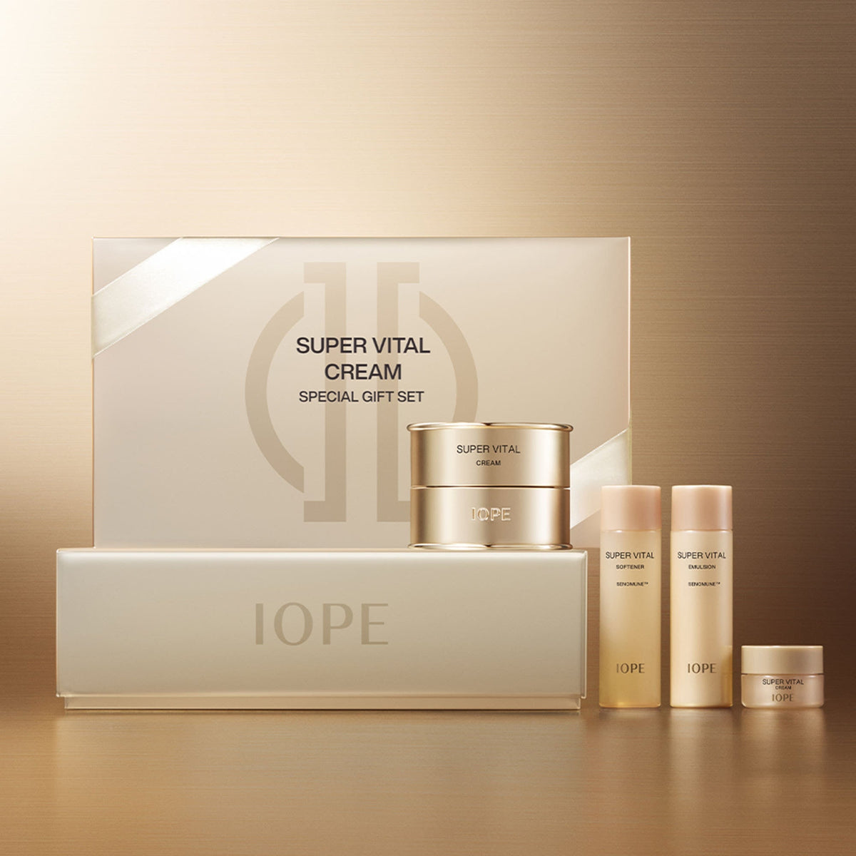 Skincare cream gift set with IOPE jar, bottles, and box in gold and pale cream.