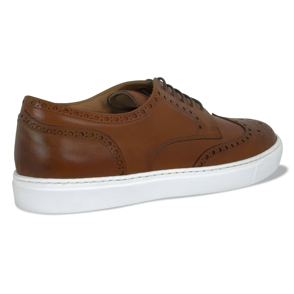 Men's cognac wingtip lace-up dress shoes, side view with white sole