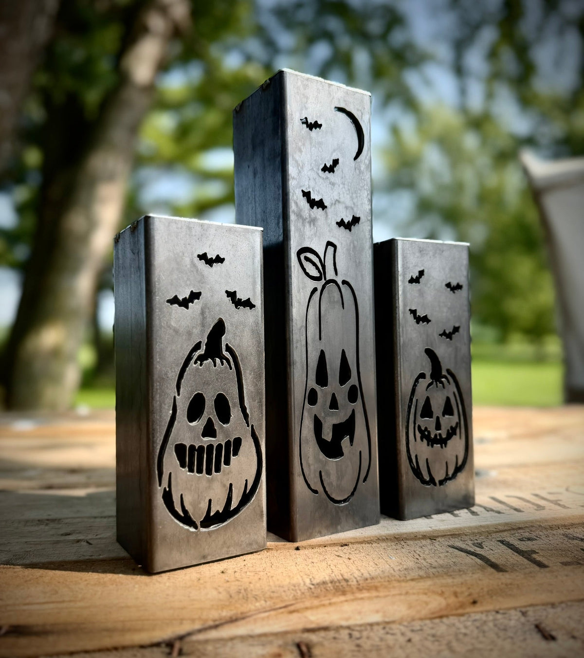 Steel solar tube lights with jack-o-lantern and bat cutout faces, three pack