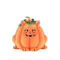 Orange plush pumpkin cat candy container with jack-o-lantern face and floral top hat
