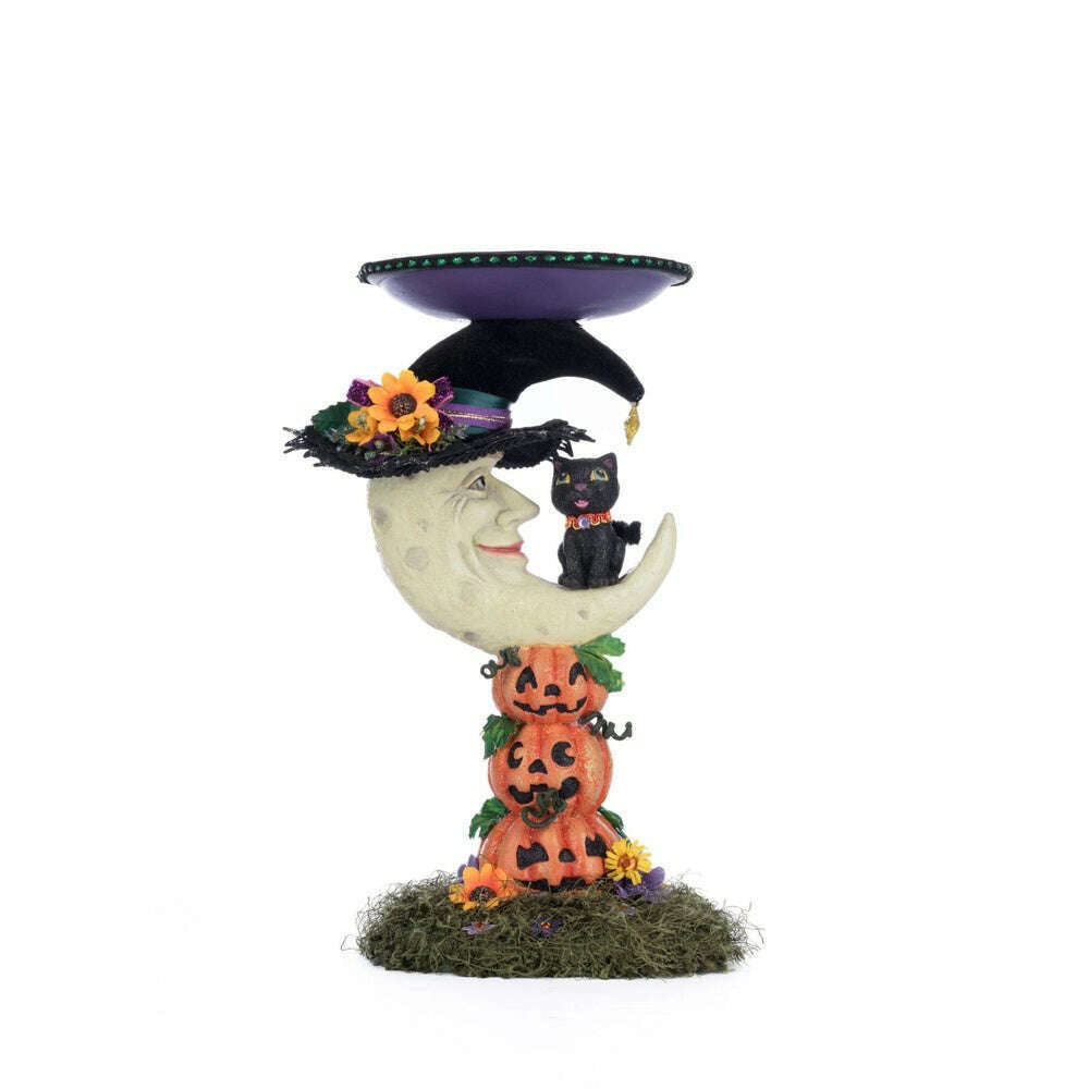 Moon pillar candle holder with purple candle tray, moon face, cat, and pumpkin decorations