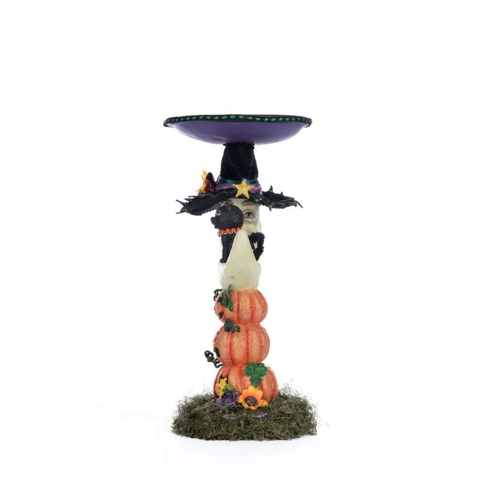 Moon pillar candle holder with purple tray and stacked pumpkins, black cap and cat detail