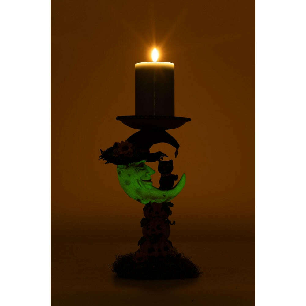 Moon pillar candle holder with lit candle on purple top and cat-and-pumpkin figure