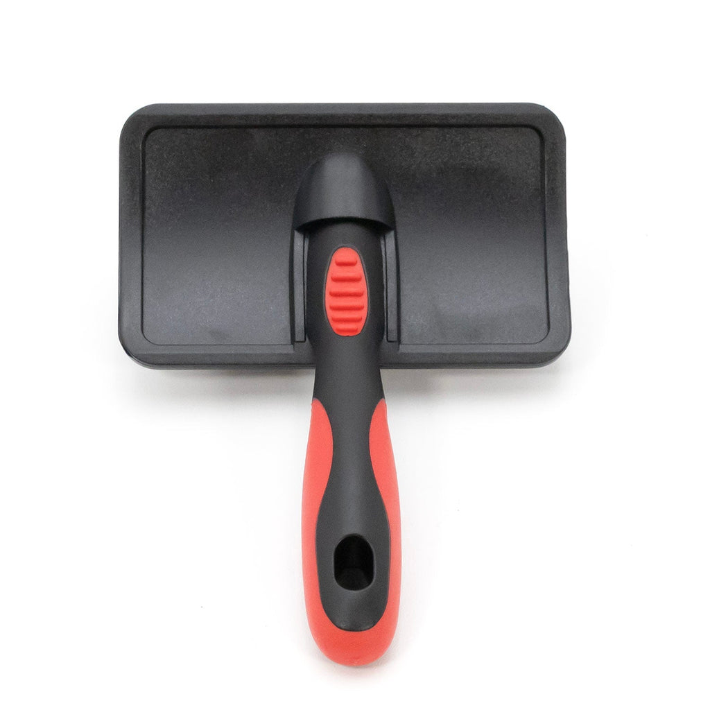 Pet grooming brush with comb insert; black case with red button and handle